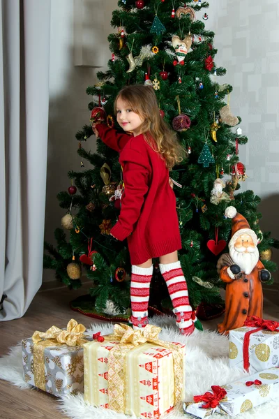 Beautiful girl in red sweater waiting Christmas and New year cel — Stock Photo, Image