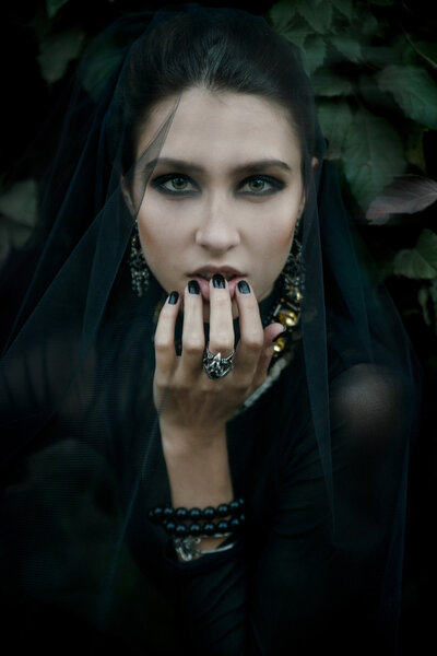 Fashiom model dressed in gothic dark style. Vamp.