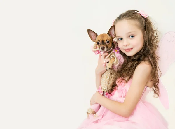 Blond kid girl with small pet dog — Stock Photo, Image