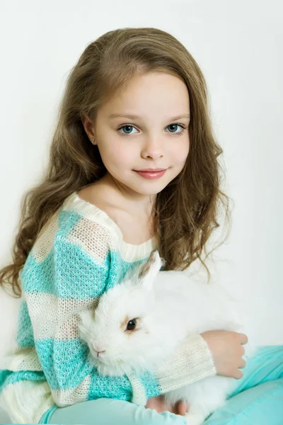 Happy little girl with rabbit — Stock Photo, Image