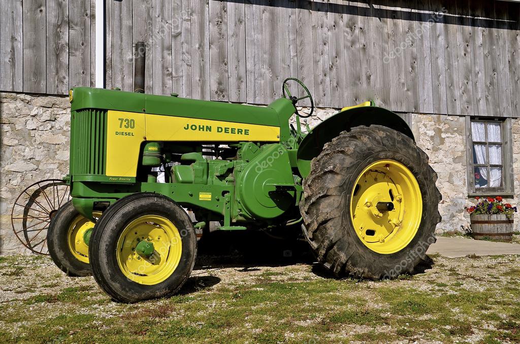Old restored John Deere 730 diesel tractor Stock Editorial Photo
