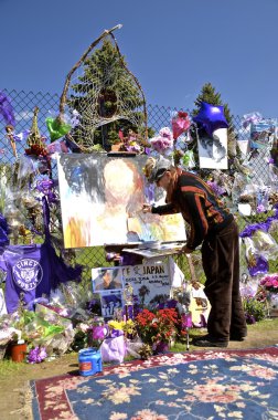 Singer Prince memorials on fence clipart