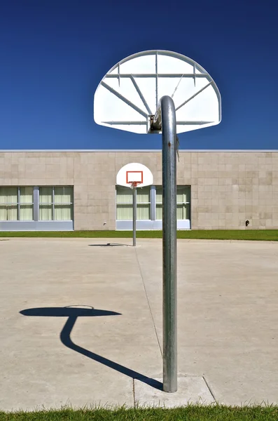 Outdoor baskets in a school yard — Stock Photo, Image