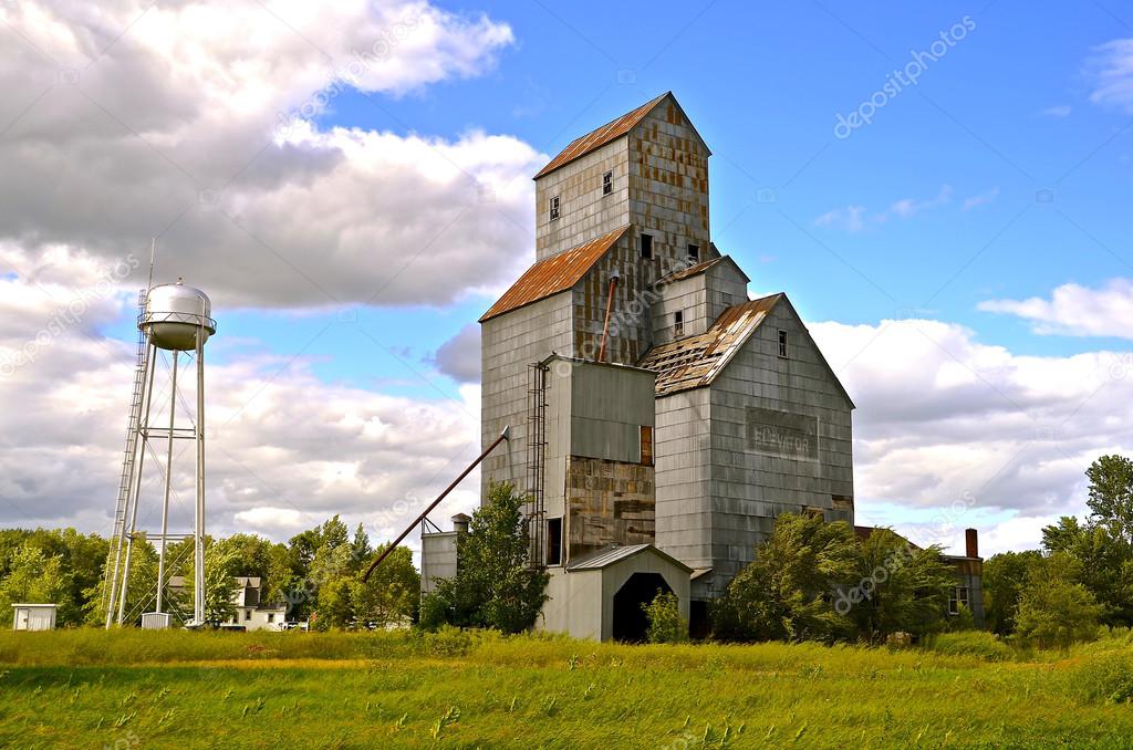 Huge abandoned old grain elevator in small town