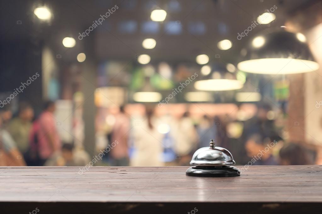 Restaurant bell on bar with bokeh — Stock Photo © ByLove 121546358