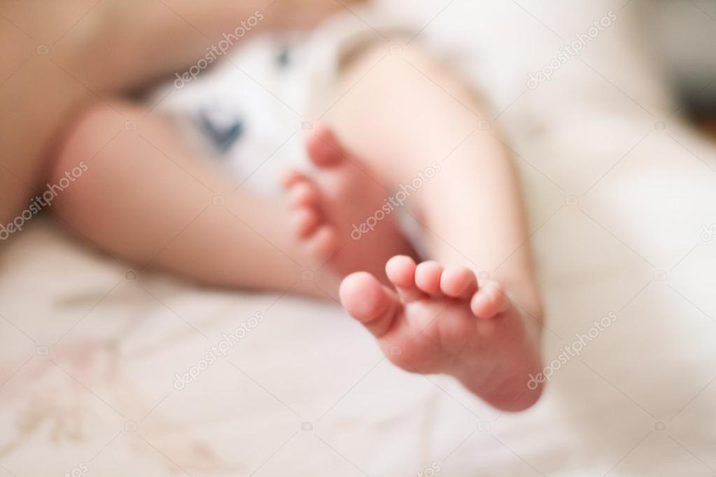 Baby feet on white