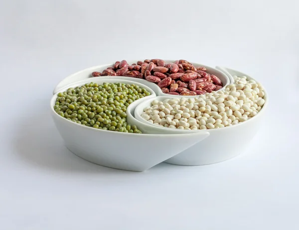 Multicolored beans in ceramics bowl — Stock Photo, Image