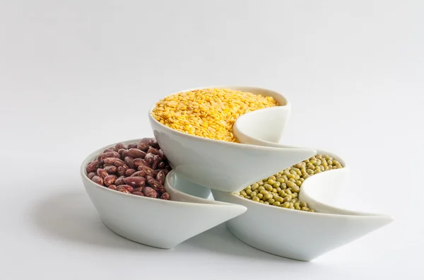 Multicolored beans in white ceramics bowl — Stock Photo, Image