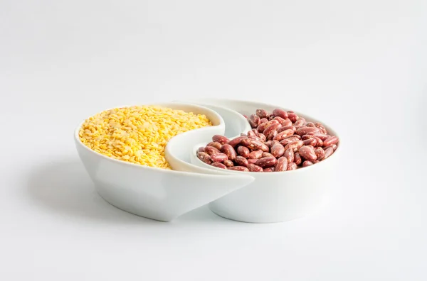 Red and yellow beans in ceramics bowl — Stock Photo, Image
