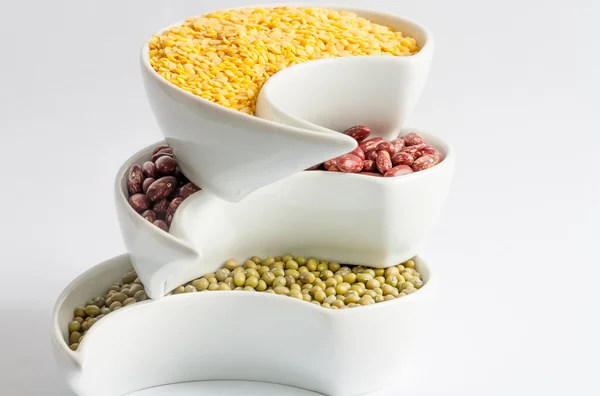 Multicolored beans in white ceramics bowl — Stock Photo, Image