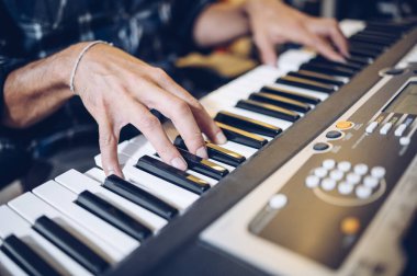 Close up of pianist's hands on the keyboard