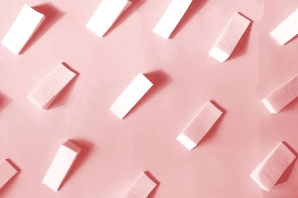 Makeup sponges on a pink background, pattern