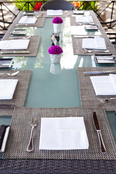 Restaurant table setting Copy space Outdoor summer tropical background.