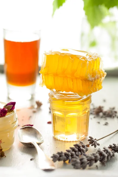 Honey variety, honeycomb in a glass jars .