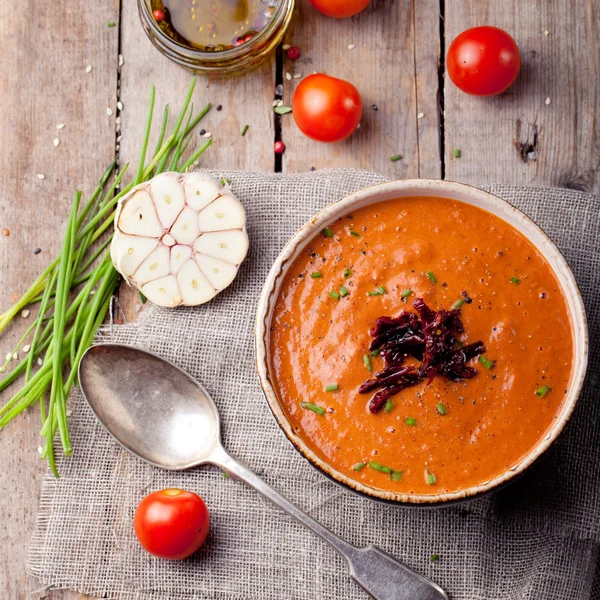 Tomato soup with sun dried tomatoes. Wooden background — Stock Image Tomato soup with sun dried tomatoes. Wooden background Stock Image