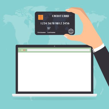 Dizüstü dizüstü ödeme için kredi kartı tutan işadamı el.