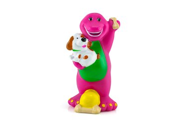 Barney mor dinozor figürü oyuncak ve beyaz köpek.
