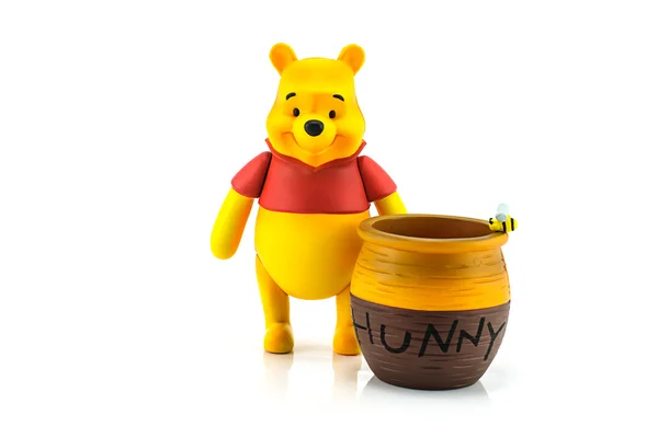 Figure of Winnie the Pooh and hunny pot — Stock Photo, Image