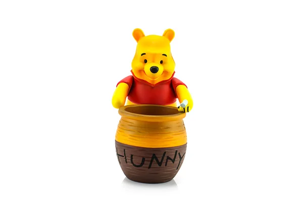 Figure of Winnie the Pooh and hunny pot — Stock Photo, Image