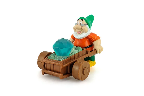 Grumpy character form 7 Dwarfs pushing wheelbarrow with a diamon — Stock Photo, Image