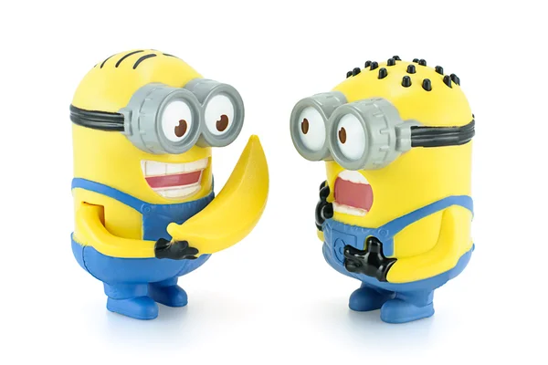 Minion Dave give banana to Minion. — Stock Photo, Image