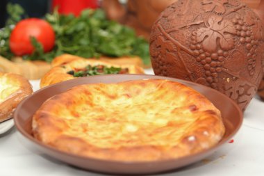 Khachapuri by Adzharia (Georgian cheese pastry), filled with cheese clipart