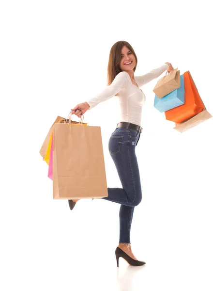 Dívka na vysokých podpatcích stojí s nákupy po prodeji Royalty Free Stock Obrázky