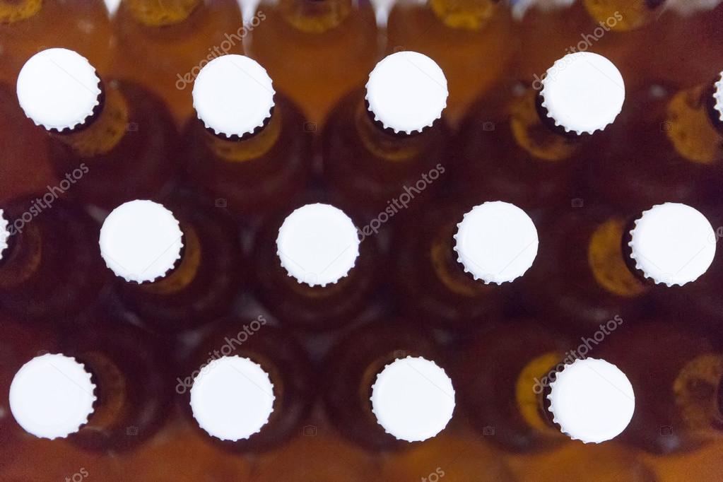 Beer bottles with white lids