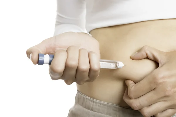 Injecting insulin with a pen — Stock Photo, Image