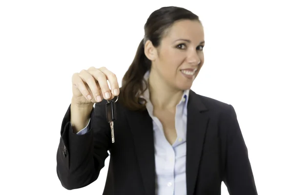 Business woman offering a car key — Stock Photo, Image