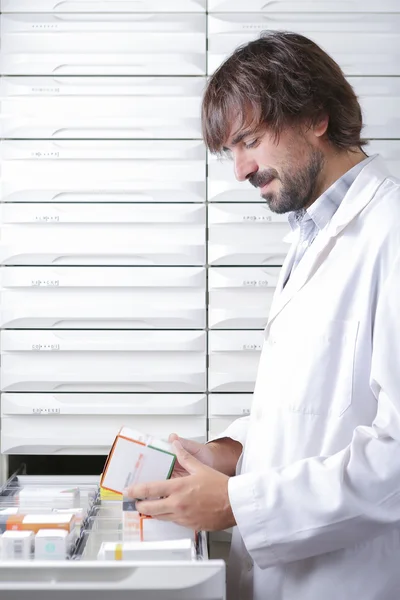 The pharmacist and the drawers — Stock Photo, Image