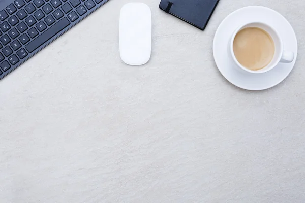 Cup of coffee on a business desk — Stock Photo, Image