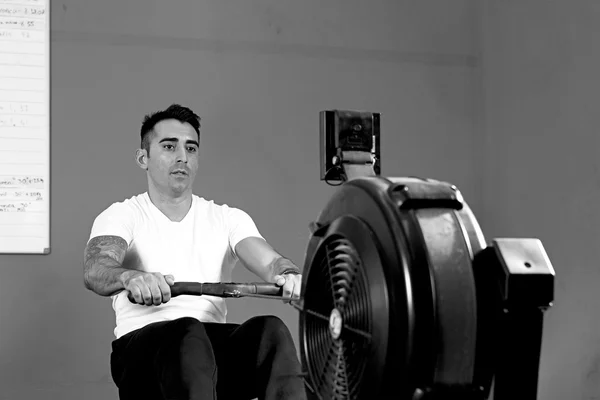 Man on rowing machine - crossfit workou — Stock Photo, Image