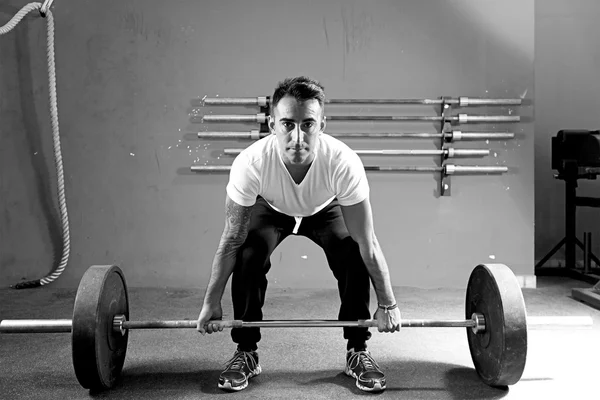 Young man on a weightlifting session - crossfit workou — Stock Photo, Image