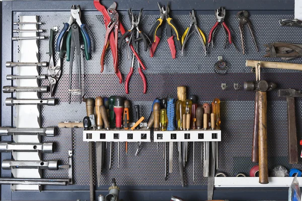 Tools on a metal board — Stock Photo, Image