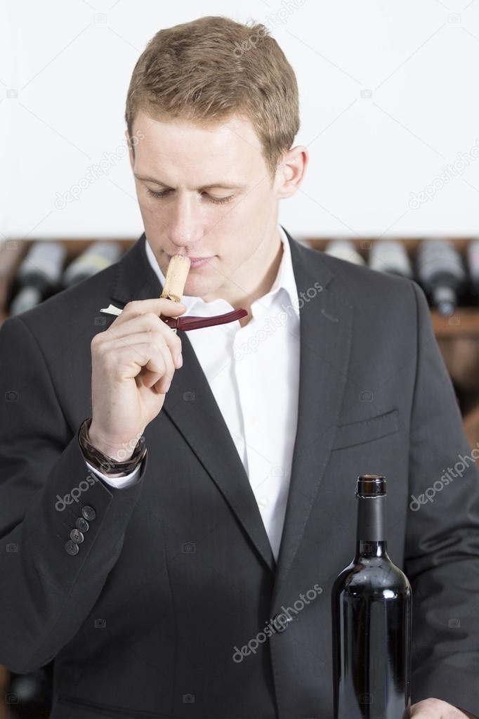 man smelling a cor