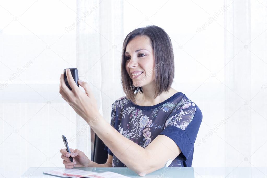 woman checking a reader