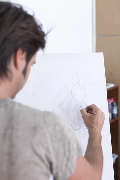 Male painter drawing on canvas - painting session — Stock Photo, Image