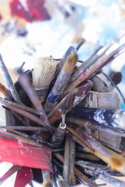 Paintbrushes on a container - painting session — Stock Photo, Image