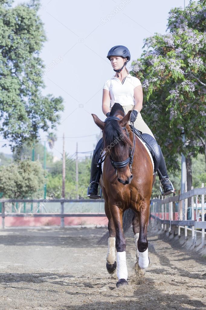 Girl riding a horse