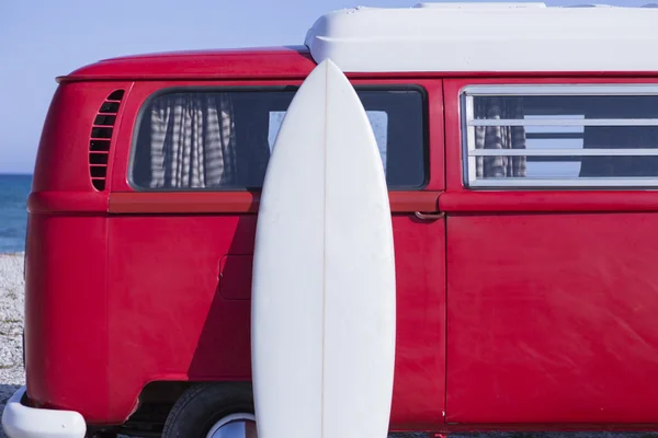 surf board and van