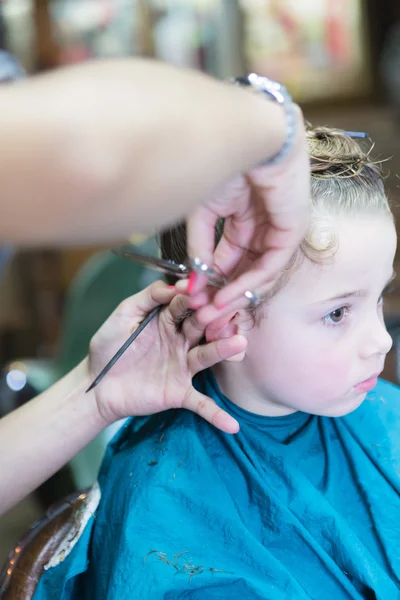 Close-up of hands cutting boy hair — Stock Photo, Image