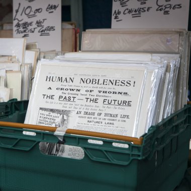  Flea market with old-fashioned goods displayed in London city, UK. On 17 January 2014. The box with old placards clipart