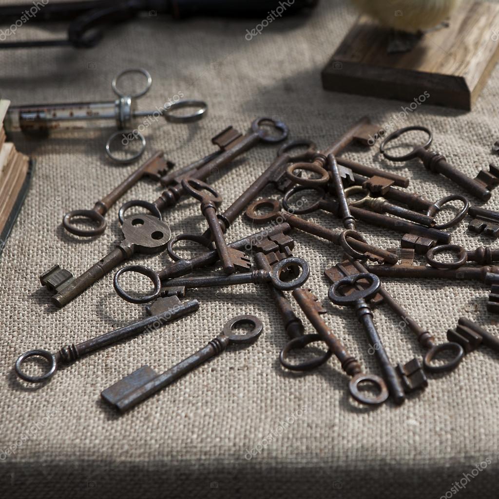 Many old keys on a well used old canvas . — Stock Photo