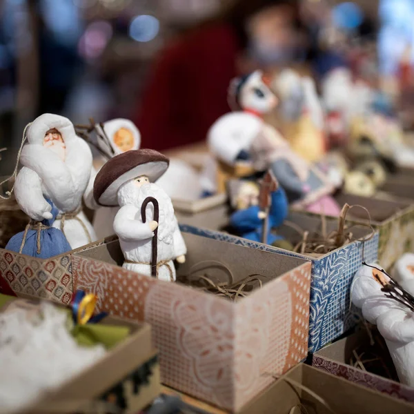 Paper Angels Trumpet into Pipes. Paper Figures As a Shop Window