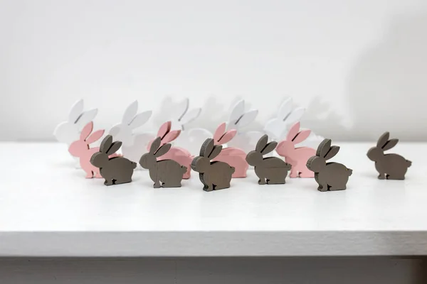 White Gray Pink Wooden Rabbits Different Sizes White Table Surface — Stock Photo, Image