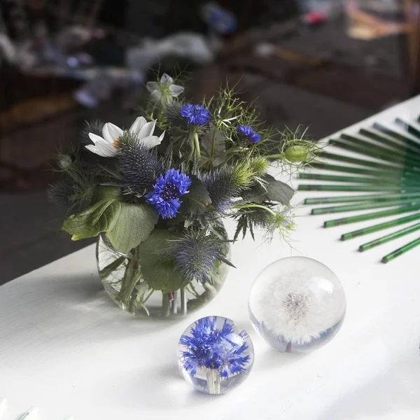 Beautiful bouquet of wild flowers with blue burr, cornflower and — Stock Photo, Image