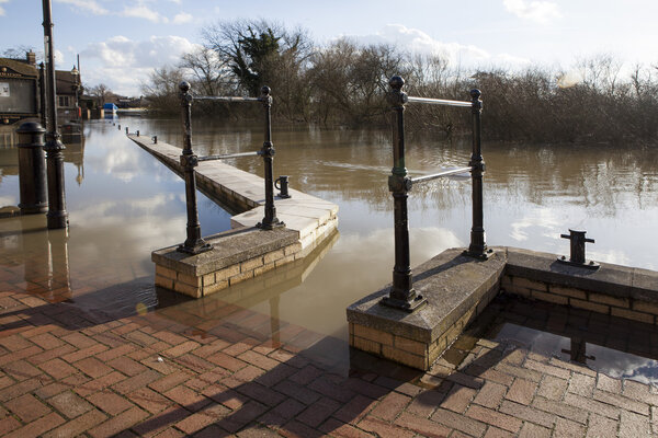 ST IVES, UK - MAR. 01: Water rises high in aftermath of February stormy weather, March 01, 2010 in St Ives, Cambridgeshire, UK. The pavement under the water.