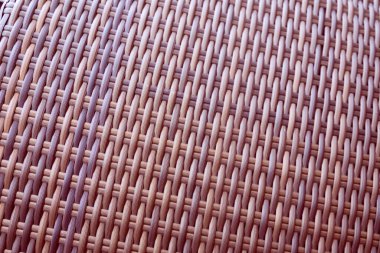 Sentetik rattan dokuma arka planı bahçe mobilyalarında kullanılıyor..