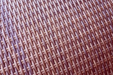Sentetik rattan dokuma arka planı bahçe mobilyalarında kullanılıyor..